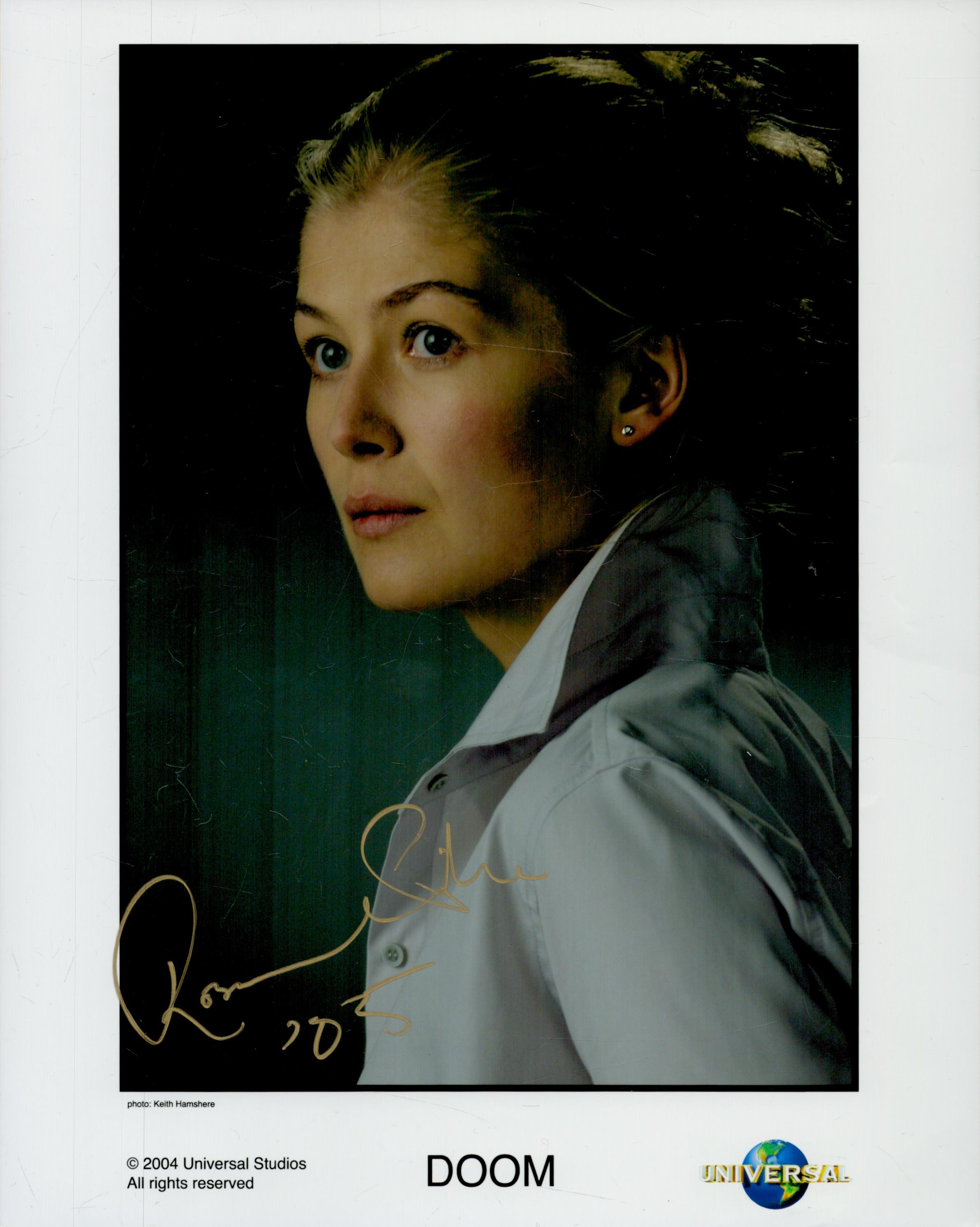 Rosamund Pike signed 10x8 inch Doom colour promo photo. Good Condition. All autographs come with a
