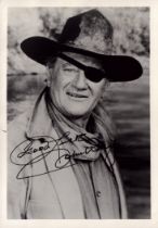 John Wayne signed 7x5 inch black and white photo. Good Condition. All autographs come with a