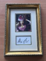 Minnie Driver signed mounted and framed colour photo with signature below. Measures 17"x12" appx.