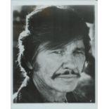 Charles Bronson signed 10x8 inch black and white photo. Good Condition. All autographs come with a