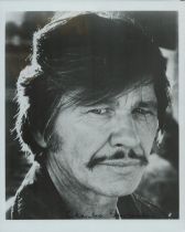 Charles Bronson signed 10x8 inch black and white photo. Good Condition. All autographs come with a