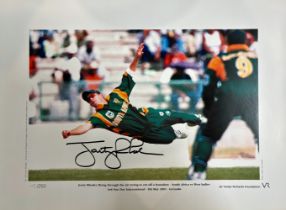 jonty Rhodes signed limited edition print with signing photo. The Jonty Rhodes legend may have begun