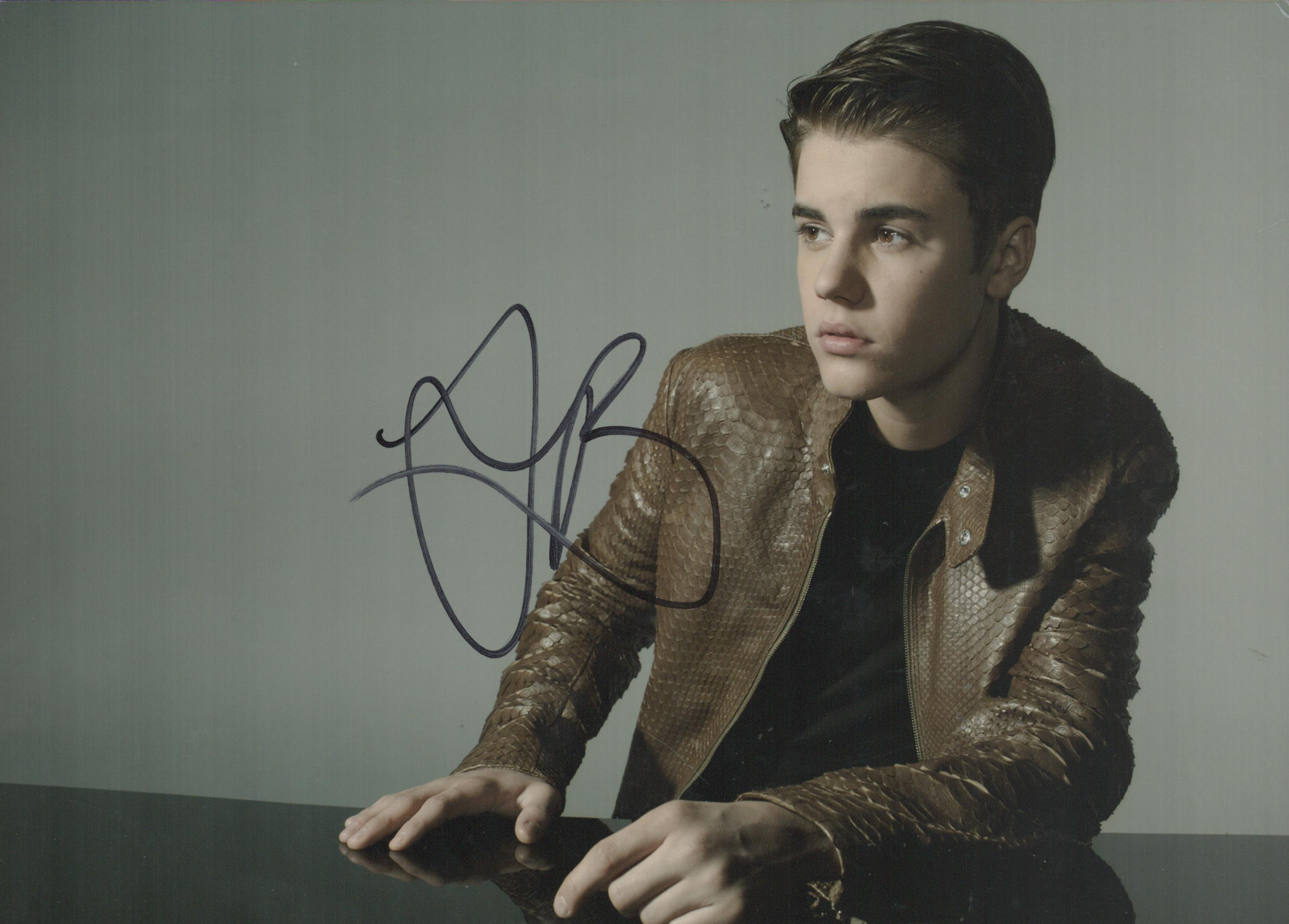 Justin Bieber signed 10 8 inch colour photo. Good Condition. All autographs come with a