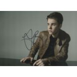 Justin Bieber signed 10 8 inch colour photo. Good Condition. All autographs come with a