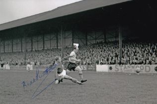 Autographed BILL PUNTON 6 x 4 Photo : B/W, depicting Norwich City's BILL PUNTON trying his best to