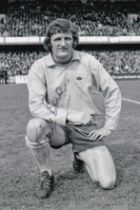 Autographed JIM BONE 6 x 4 Photo : B/W, depicting Norwich City centre-forward JIM BONE striking a