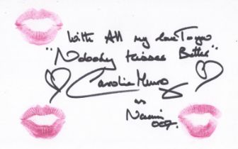 007 James Bond actress Caroline Munro signed 8x5 inch card upon which she has left the lipstick mark