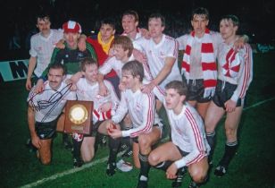 Autographed WILLIE MILLER 12 x 8 Photo : Col, depicting Aberdeen players celebrating with the UEFA