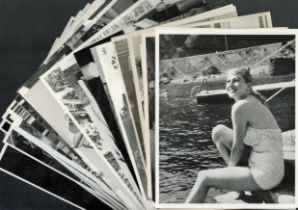 Unsigned photo collection of approx 30 black and white photos and movie stills. Good Condition.