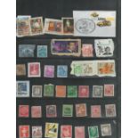 38 used Stamps in a black holder James Bond in Goldeneye, Dorothy Hodgkin, and various German