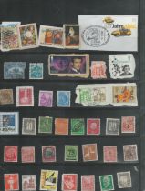 38 used Stamps in a black holder James Bond in Goldeneye, Dorothy Hodgkin, and various German