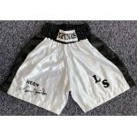 Boxing Legend, Leon Spinks Signed Personalised Boxing Shorts. These white shorts are signed in black