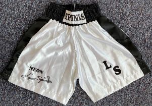 Boxing Legend, Leon Spinks Signed Personalised Boxing Shorts. These white shorts are signed in black