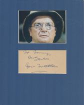Don Estelle signature piece mounted below colour Ain't Half hot mum photo. Approx overall size