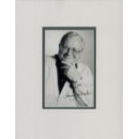 Harry Secombe signed small black and white photo, mounted to an overall size of 10 x 8 inches.