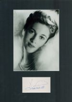 Joan Fontaine signature piece mounted below black and white photo. Approx overall size 16x12inch.