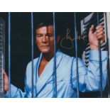 Roger Moore signed 10x8 inch James Bond colour photo. Good Condition. All autographs come with a