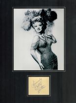 Betty Hutton signature piece mounted below black and white photo. Approx overall size 16x12inch.