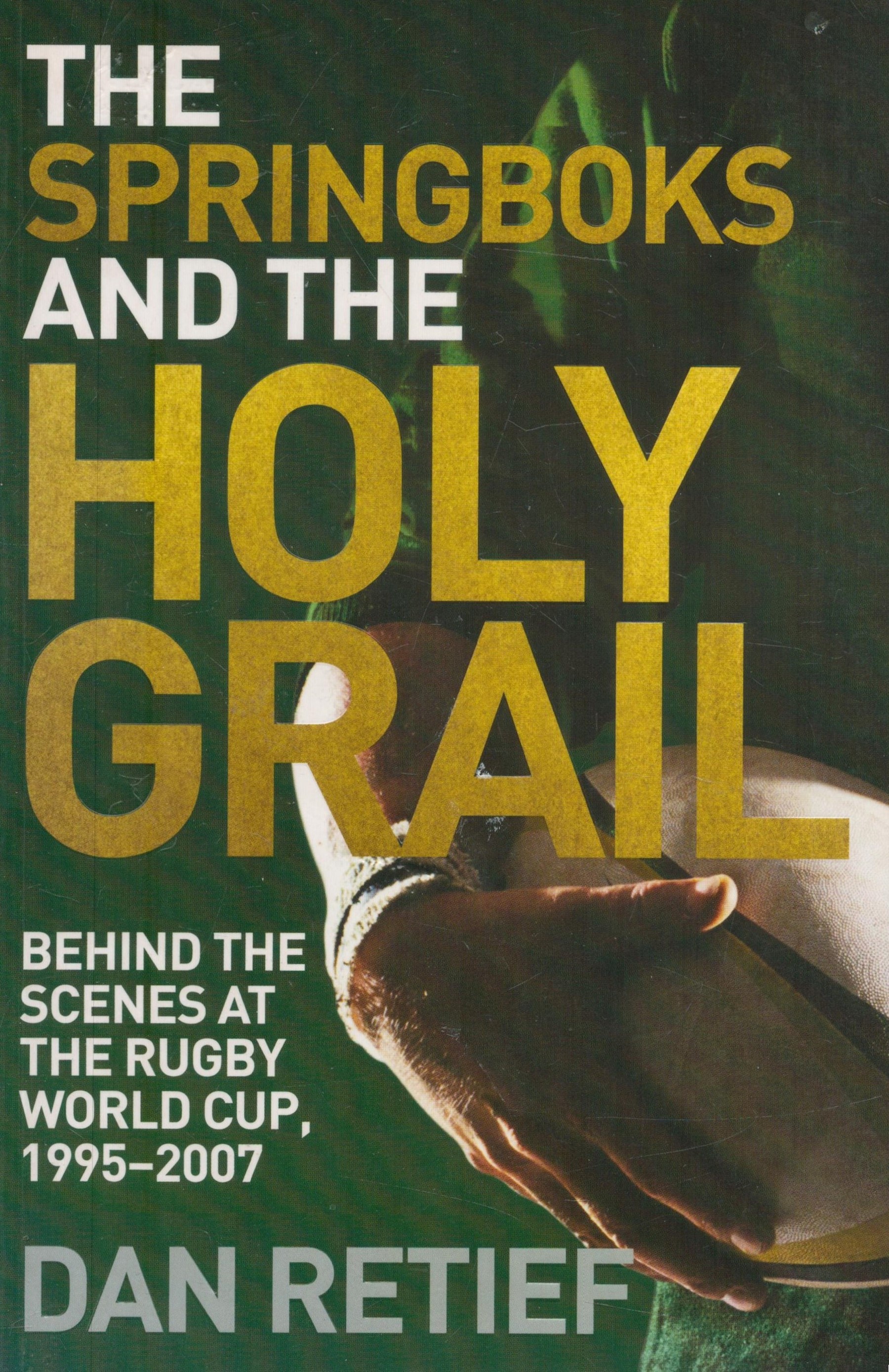 Dan Retief signed The Springboks and the Holy Grail softback book. Signed on inside title page.