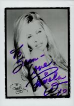 Pamela Anderson signed 7x5 inch black and white photo dedicated. Good Condition. All autographs come