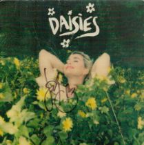 Music Katie Perry signed 45 RPM record sleeve for the hit Daisies. Good Condition. All autographs