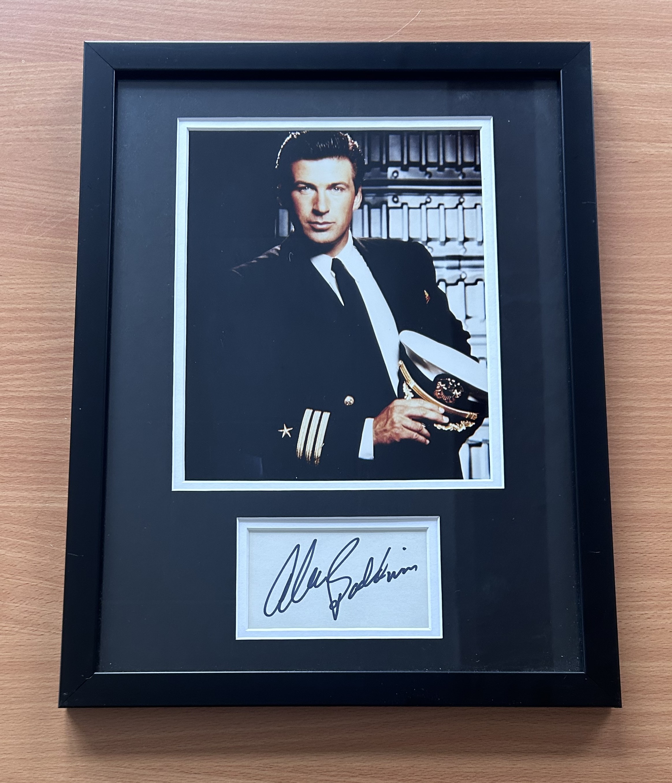 Alec Baldwin signed colour photo in frame with signature below. Measures 17"x13" appx. Good