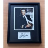 Alec Baldwin signed colour photo in frame with signature below. Measures 17"x13" appx. Good