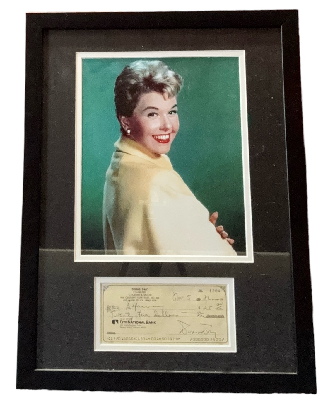 Doris Day mounted Signed Cheque for $25.00 dated November 5th, 1986, framed with colour photo,