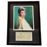 Doris Day mounted Signed Cheque for $25.00 dated November 5th, 1986, framed with colour photo,