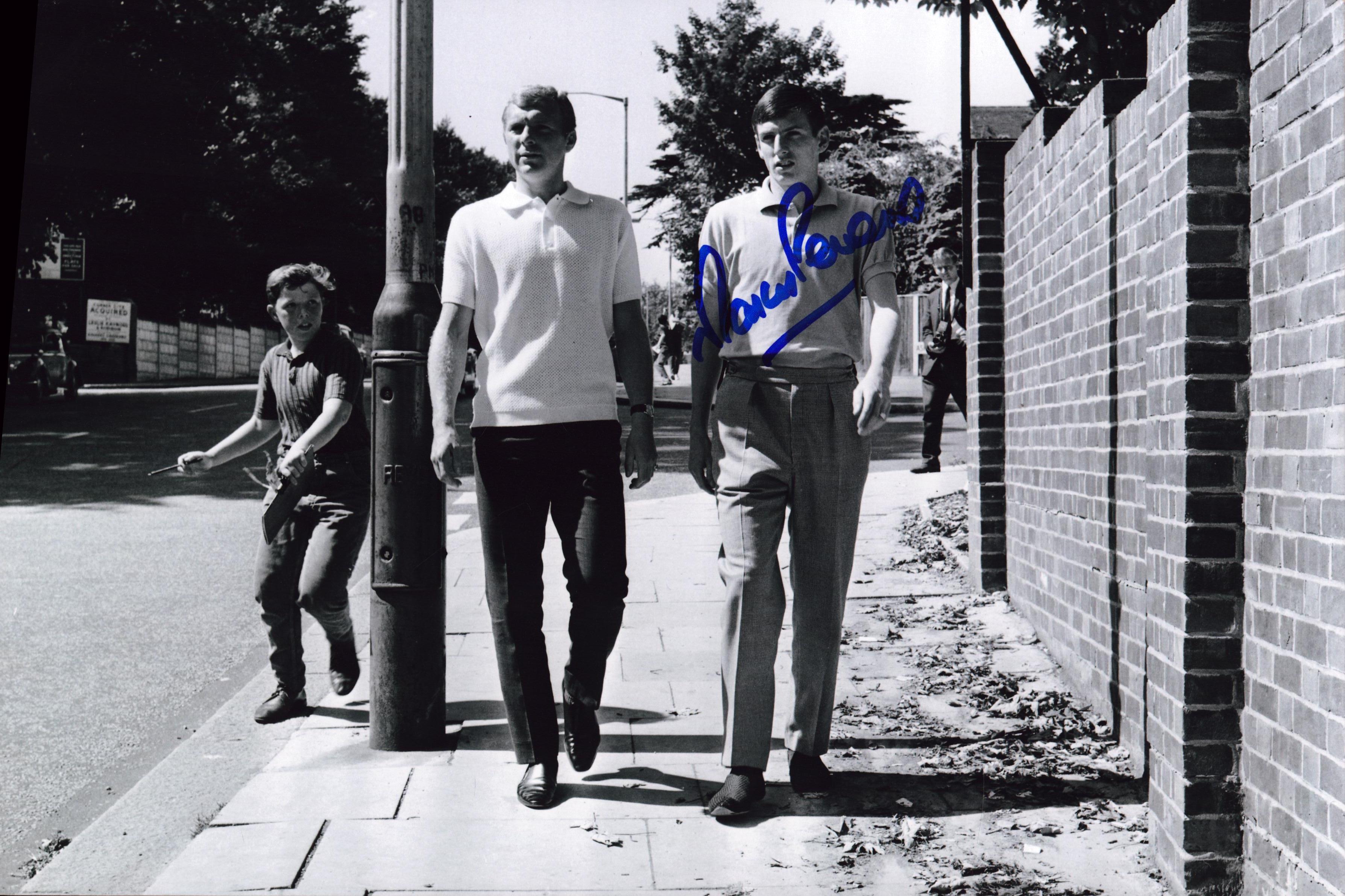 Marin Peters signed 12x8 inch black and white photo pictured with Bobby Moore. Good Condition. All