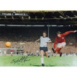 Geoff Hurst signed 16x12 inch colour photo pictured scoring his hat trick goal during the 1966 world