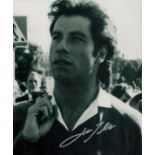 John Travolta signed 10x8 inch black and white photo. Good Condition. All autographs come with a