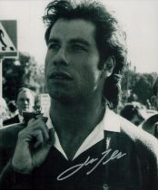 John Travolta signed 10x8 inch black and white photo. Good Condition. All autographs come with a