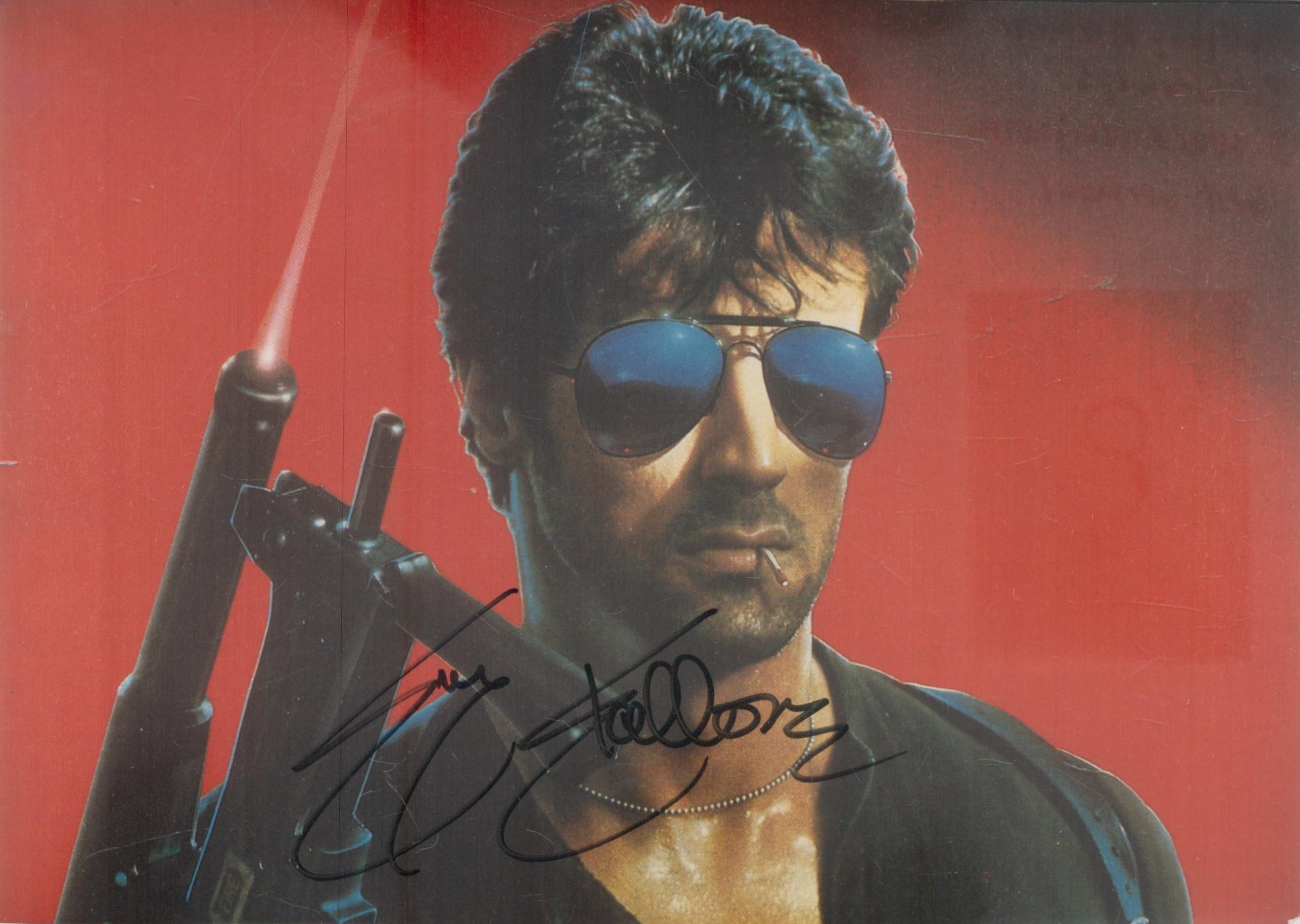 Sylvester Stallone signed 7x5 inch Cobra colour photo. Good Condition. All autographs come with a