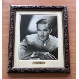 Errol Flynn signed mounted and framed black and white photo, with gold name plaque below. Measures