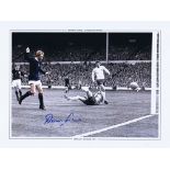 Autographed DENIS LAW 16 x 12 Photo-Edition : Colorized, depicting Scotland striker DENIS LAW