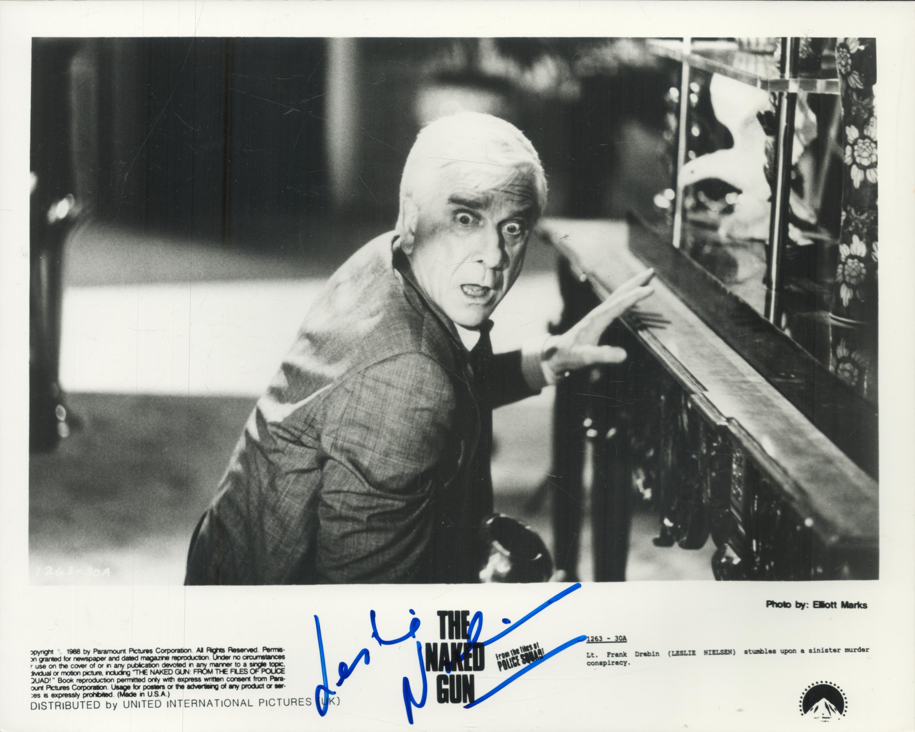 Leslie Nielsen signed 10x8 inch Naked Gun black and white movie still photo. Good Condition. All