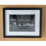 Glen Hoddle signed 17x14 overall framed and mounted black and white photo pictured in action for