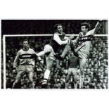 Martin Peters signed 12x8 inch black and white photo pictured in action for West Ham United. Good