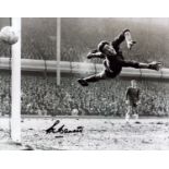 Peter Bonetti signed 12x8 inch black and white photo pictured in action for Chelsea. Good Condition.