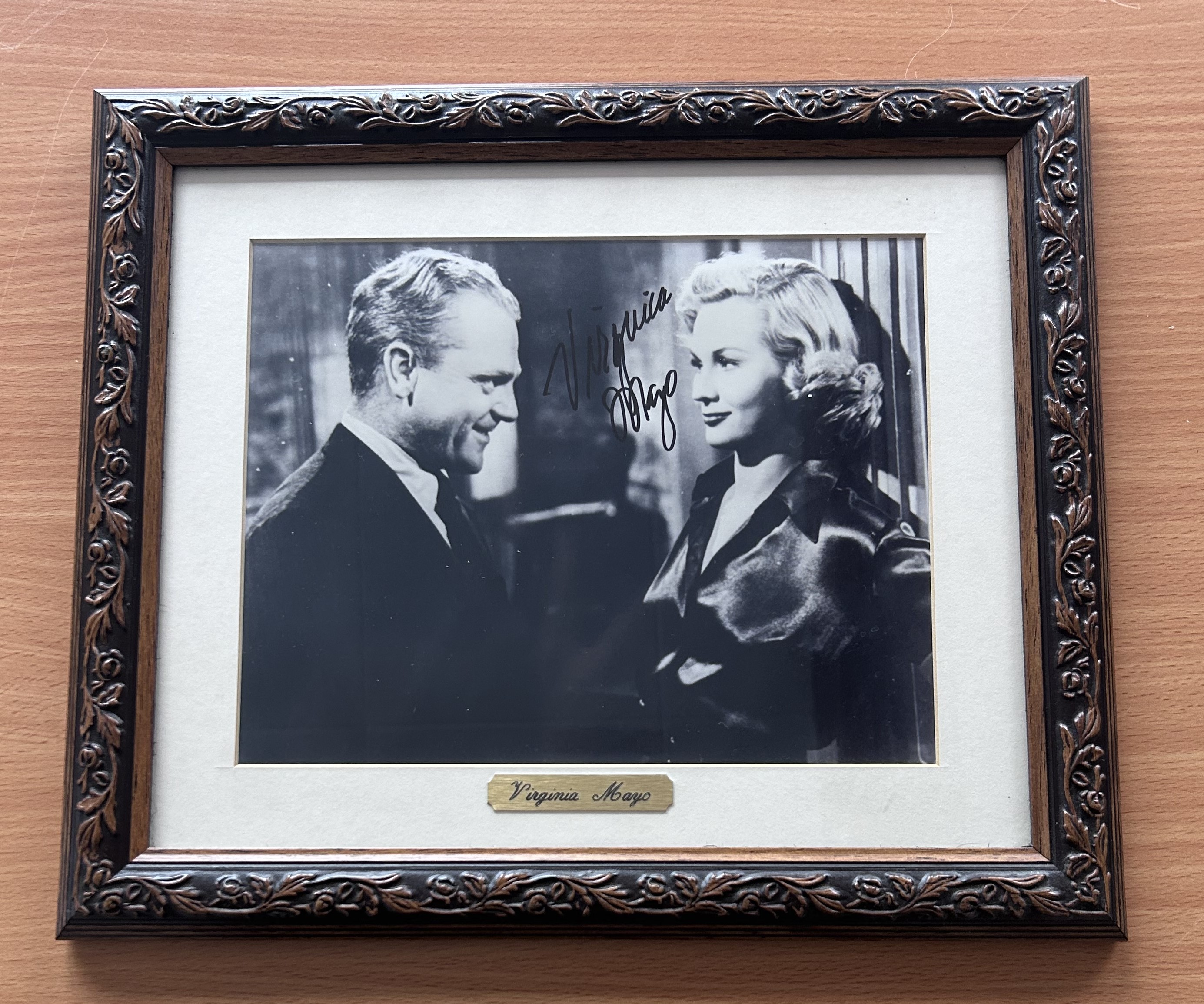 Virginia Mayo signed mounted and framed black and white photo. With gold name plaque below. Measures