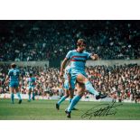Geoff Hurst signed 16x12 inch colour photo pictured in action for West Ham United. Good Condition.