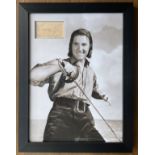 Errol Flynn signed card inset in black and white photo. Framed to approx size 20x14inch. (20 June