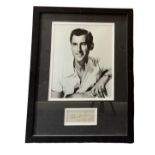 Stewart Granger mounted signature with Black and white photo framed. Measures 17"x13" appx. Good