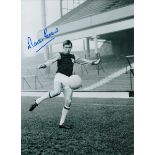 Martin Peters signed 16x12 inch black and white photo pictured during his playing days with West Ham