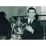 Bobby Smith signed 16x12 inch black and white photo picturing the Spurs legend with the FA Cup. Good