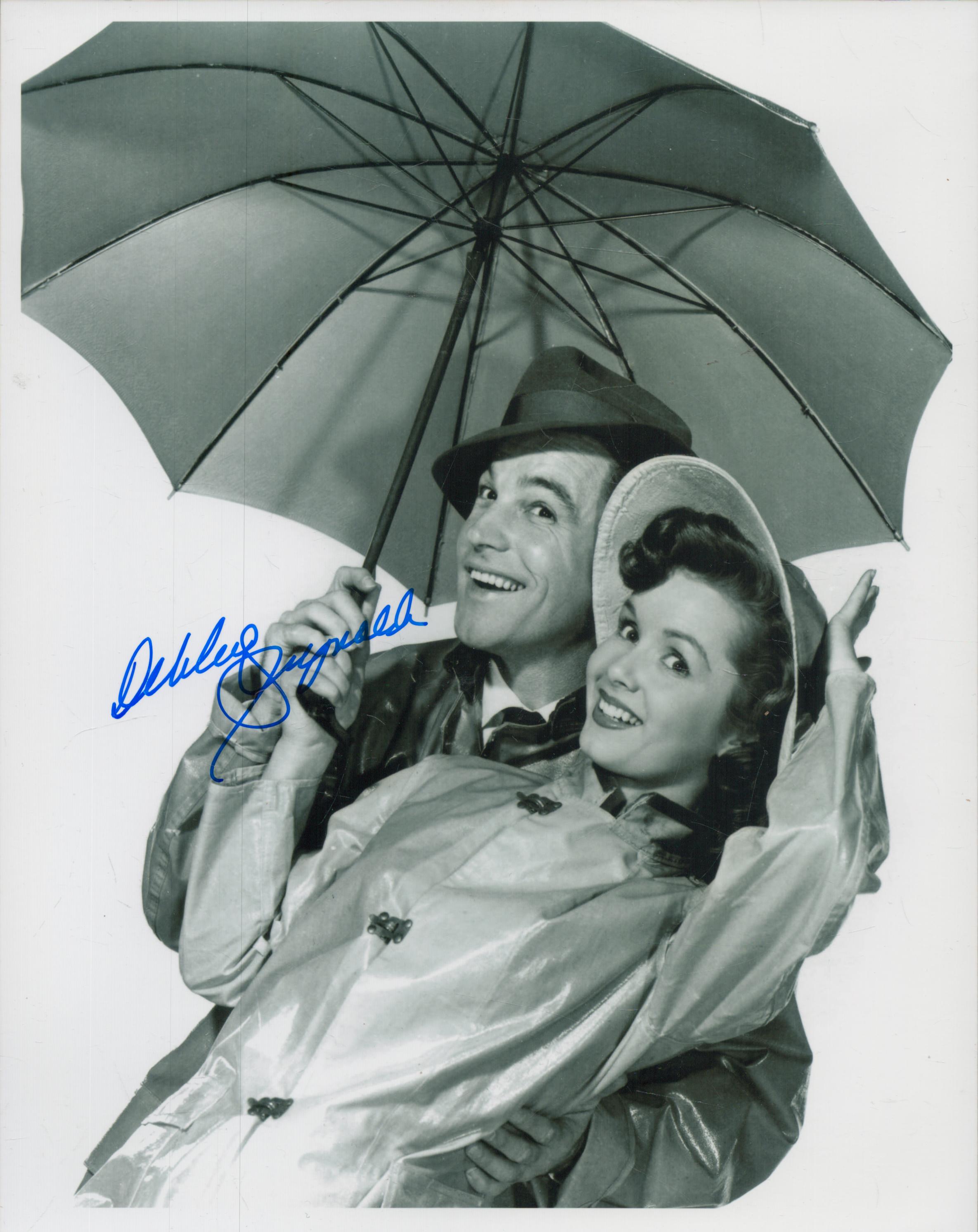 Debbie Reynolds signed 10x8 inch black and white photo. Good Condition. All autographs come with a