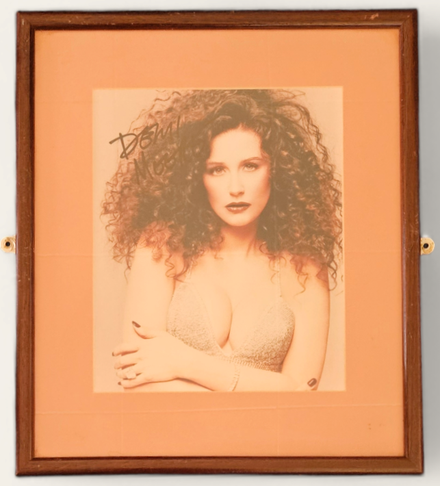 Demi Moore Signed colour photo. Framed. Measures 12 inch by 14-inch appx. Good Condition. All