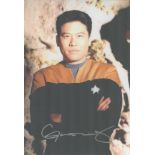 Garrett Wang signed 12x8 inch Star Trek colour photo. Good Condition. All autographs come with a