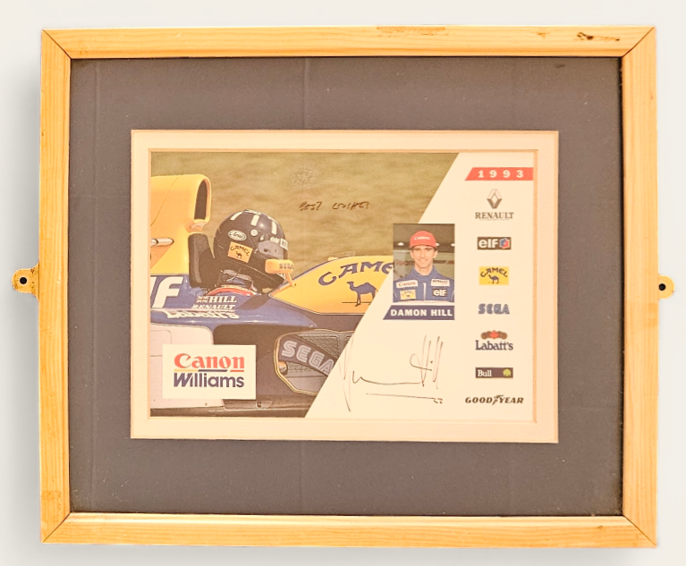 Damon Hill Signed photo, pictured in Formula One Williams Race Car. Framed. Measures 13 inch by